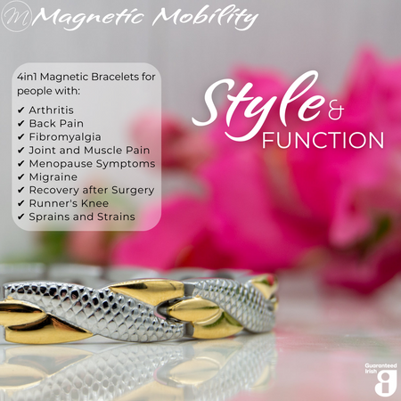 Front view of the Snapdragon Moon 4in1 Magnetic Bracelet, silver and gold coloured bracelet with snakeskin type designs, designed for pain relief, featuring various therapeutic elements. The bracelet is shown on a reflective surface with a pink flower behind it.