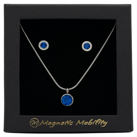 December Magnetic Mobility Birthstone Gift Set featuring a Magnetic Necklace and Stud Earrings featuring Blue Swarovski crystals, elegantly presented in a black box with Magnetic Mobility branding. These magnetic back earrings offer stylish pain relief.